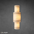An elegant San Marco Alabaster Grand Round Sconce with a soft, natural texture, diffusing light to create a warm ambiance.