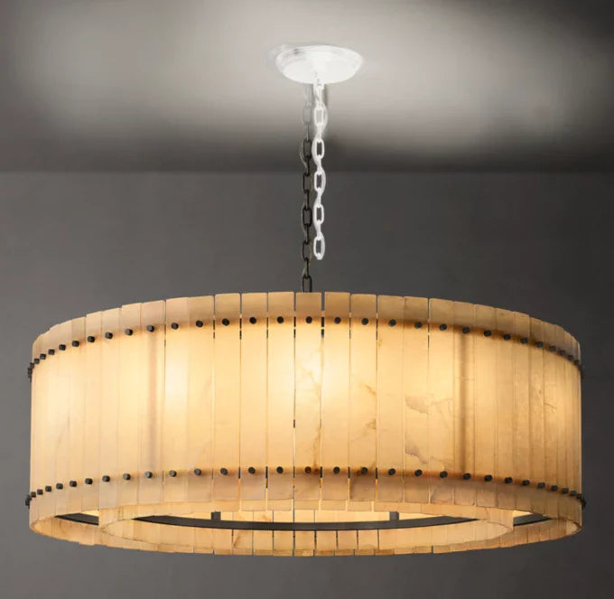 A round San Marco Alabaster chandelier with a metallic frame and alabaster panels, hanging from a ceiling fitter.
