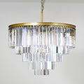 Crystal chandelier with gold fixture on a light gray background