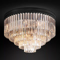 A luxurious multi-layered round ceiling crystal light fixture with gold trimmings.