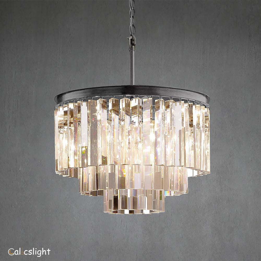 A luxurious multi-layered round chandelier with transparent crystals and a gold-colored metal frame, designed for indoor use