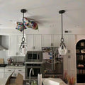 Modern kitchen with pendant lights and white cabinets