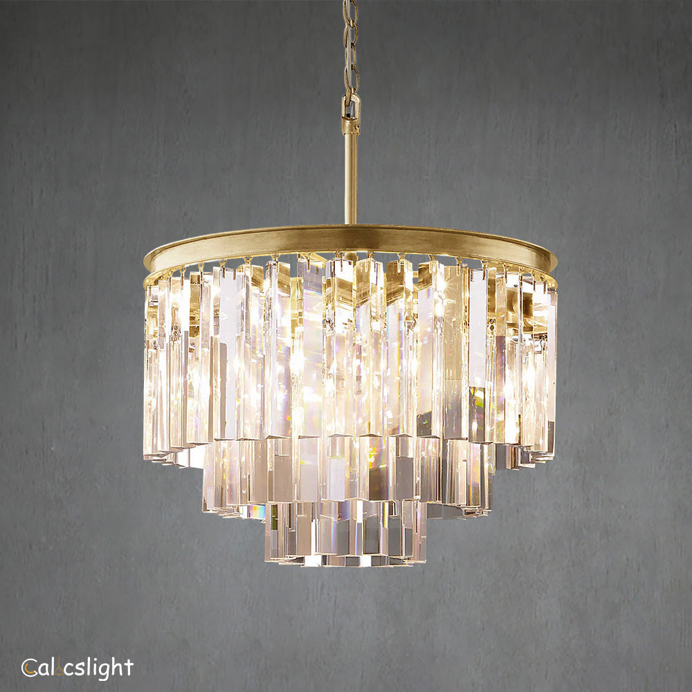 A luxurious multi-layered round chandelier with transparent crystals and a gold-colored metal frame, designed for indoor use