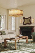 A round San Marco Alabaster chandelier with a metallic frame and alabaster panels, hanging from a ceiling fitter.