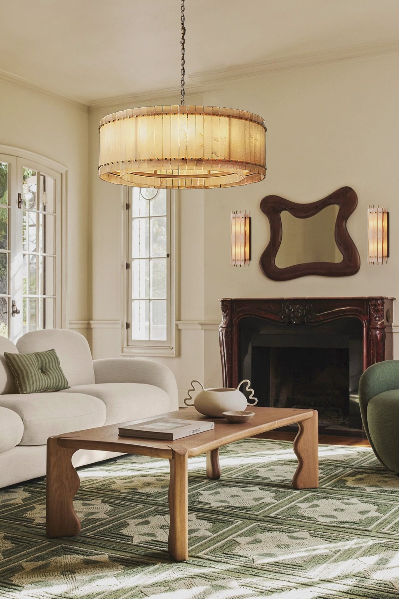 A round San Marco Alabaster chandelier with a metallic frame and alabaster panels, hanging from a ceiling fitter.